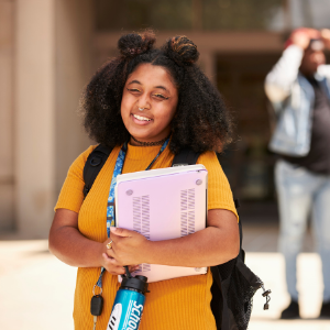 Student holding books