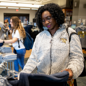 Person looking at shirt in bookstore