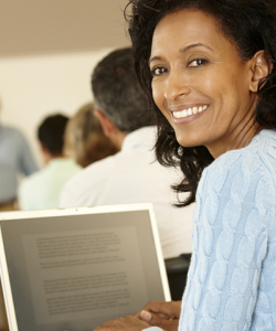 Woman smiling at her computer