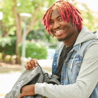 Student opening backpack