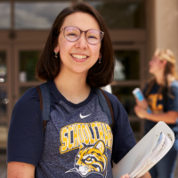 Student holding books