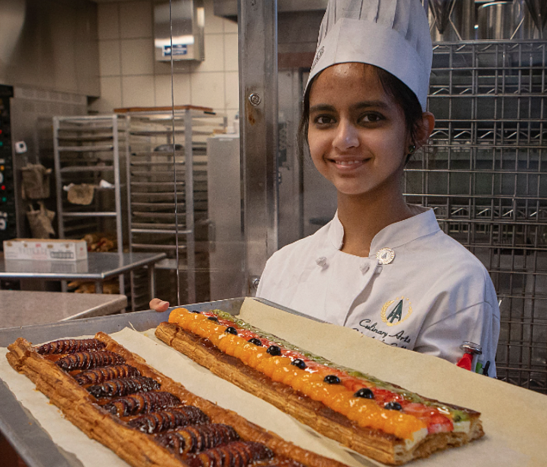 person holding tray of pastries