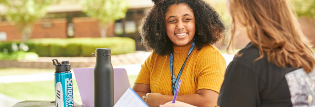 Two students studying outdoors