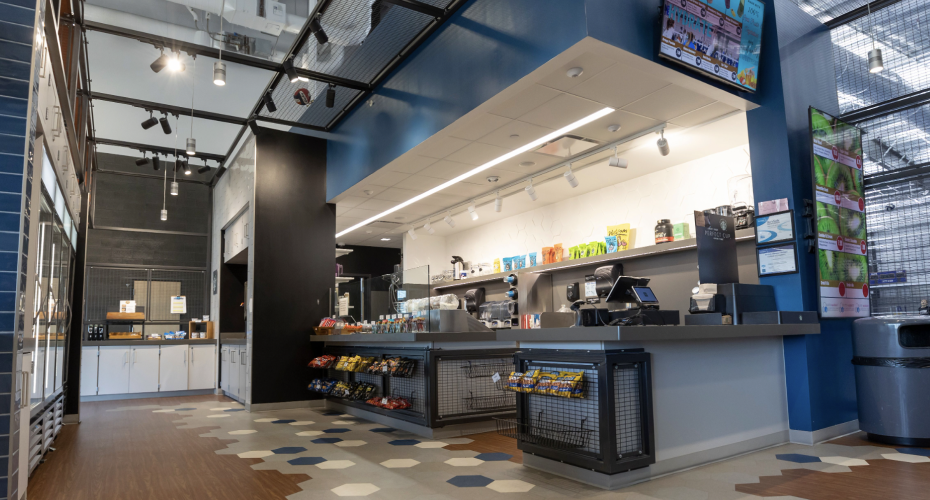 corner shop with menu screens and snacks display