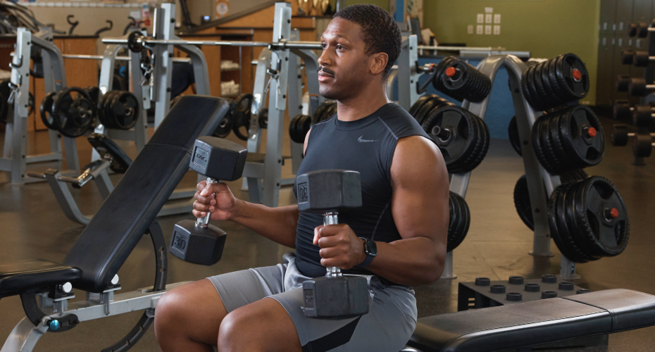 person holding dumbbells