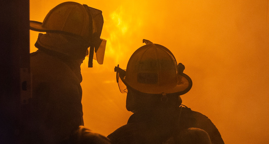 firemen looking at high flames