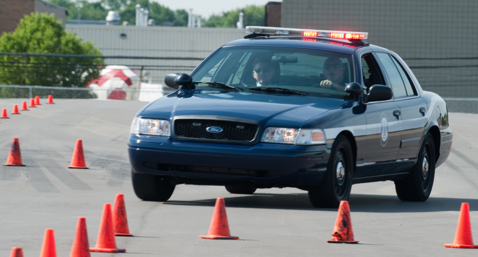 car driving around cones