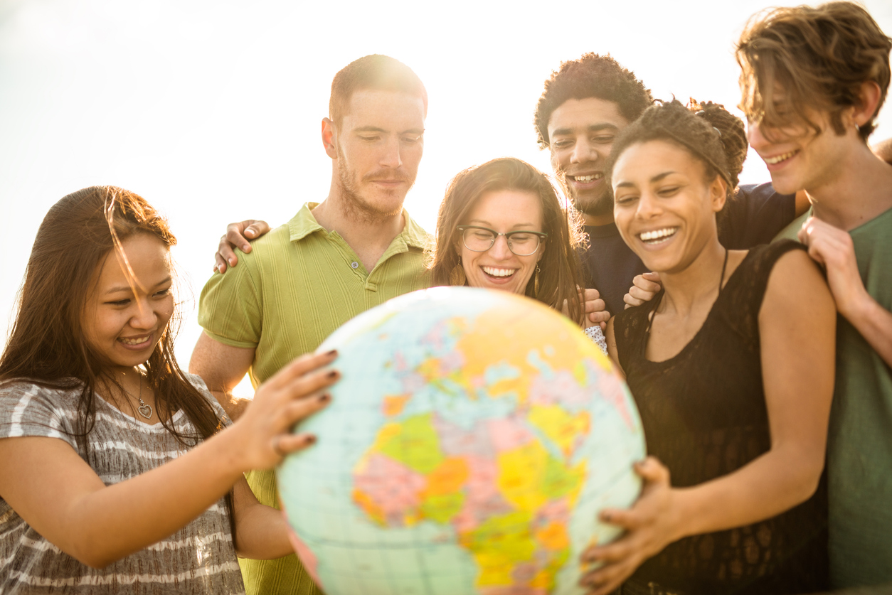 people holding a world globe