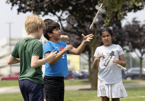 kids flying small rockets