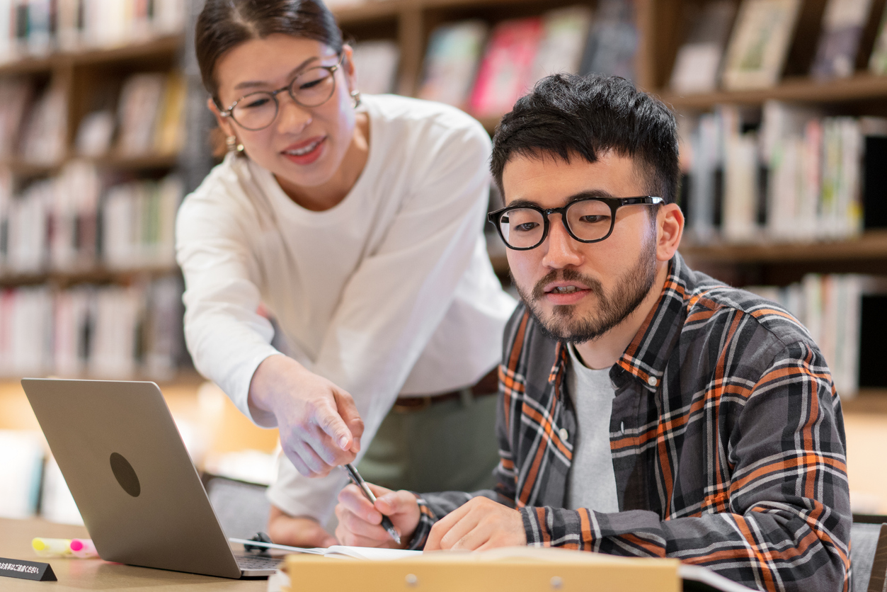 students studying at library table