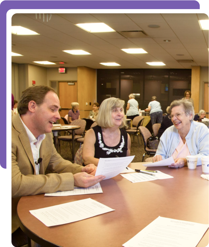 People conversing at a round table