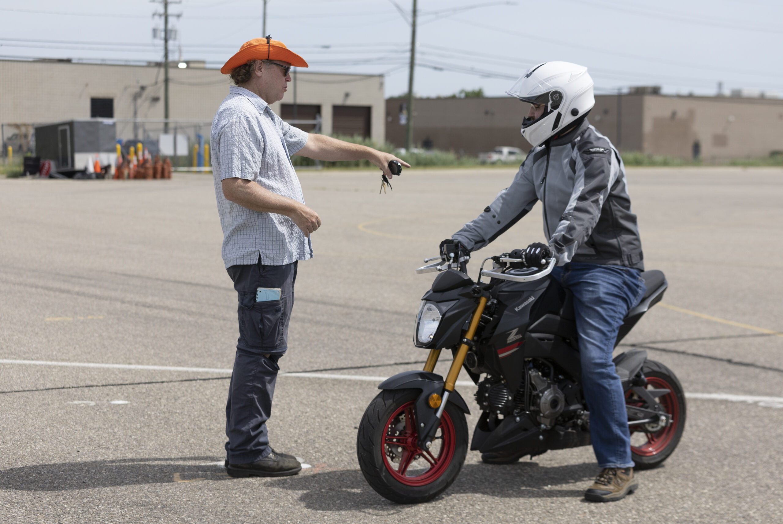 two motorcyclists talking