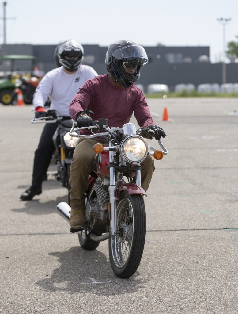 two people riding motorcycle