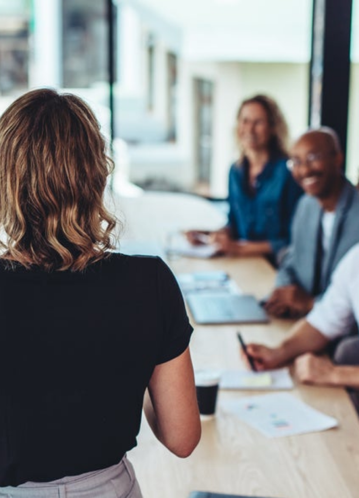 person speaking to table group