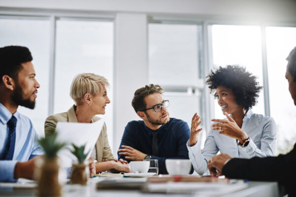 business people conversing around a table