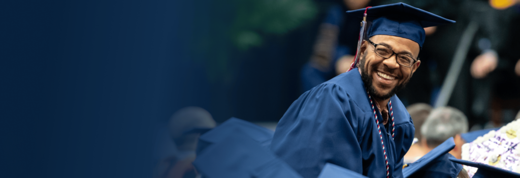 student graduate smiling in the crowd