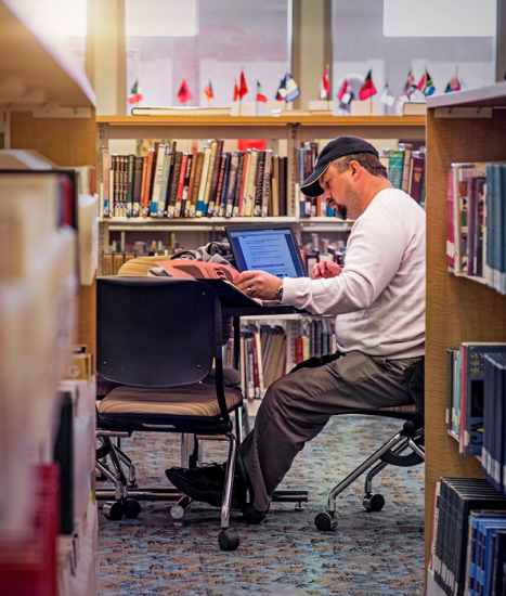 Student working at a library table