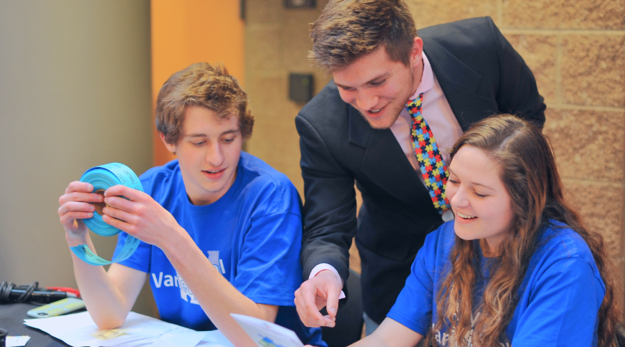 students at event table