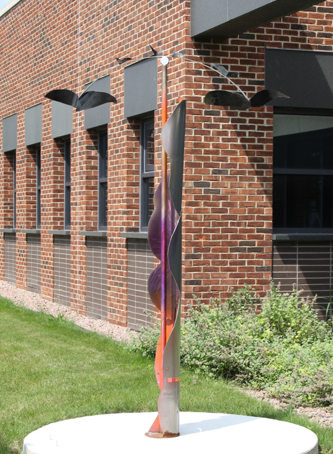 metal sculpture of abstract wave pole