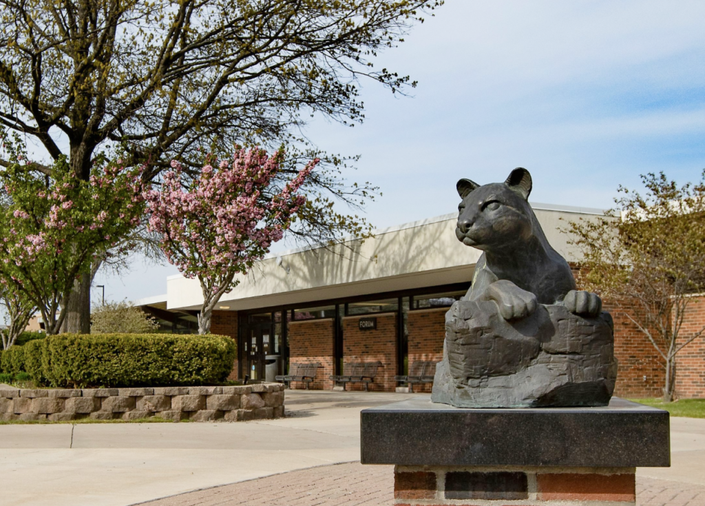 ocelot statue outside greenery