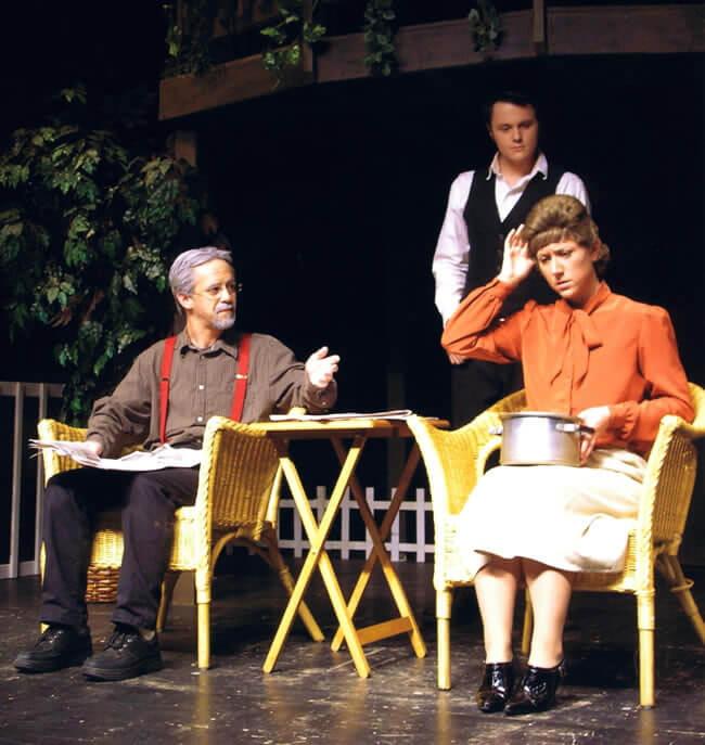A couple having a discussion at a restaurant stage set.