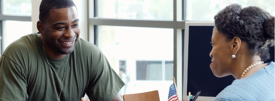 someone assisting a vet at a desk