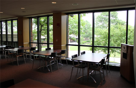 room of tables against large windows