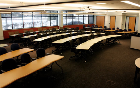 three sections of rows of tables in large room