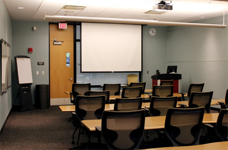 rows of table and projector screen