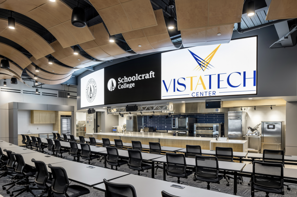 demonstration kitchen with auditorium seating and large digital screen