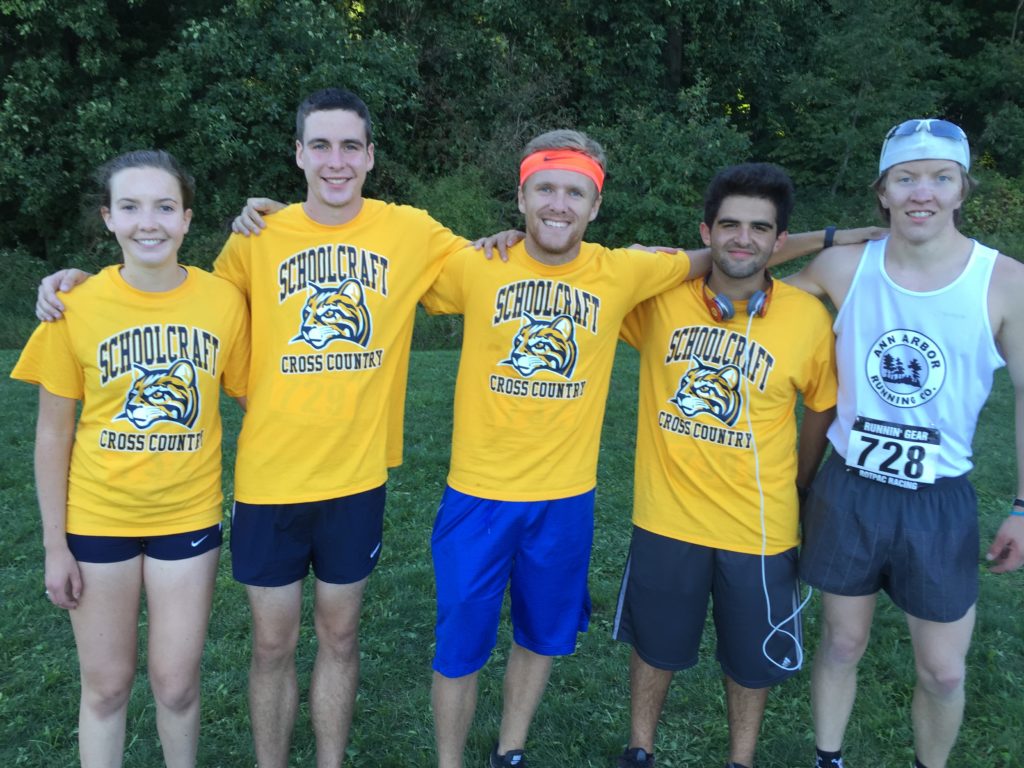 Group of cross country athletes posing for camera