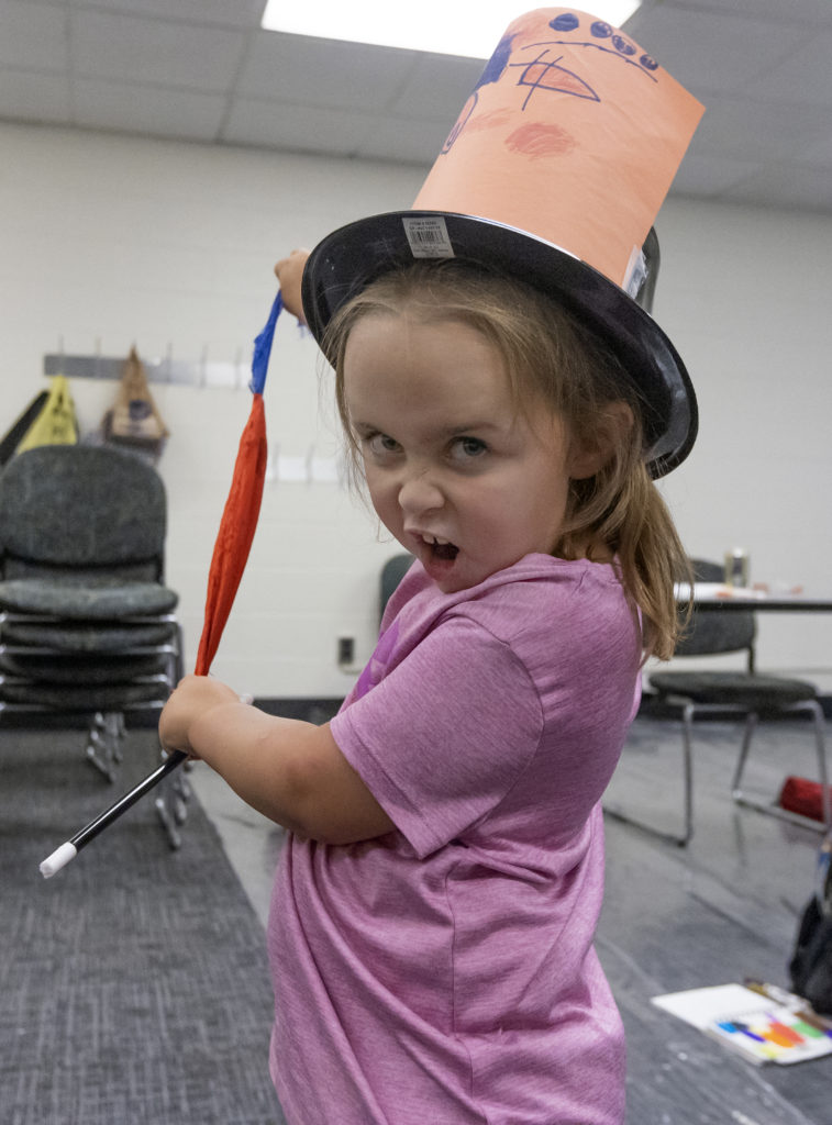 Girl wearing paper hat