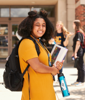 Students holding books