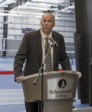 Man stands at podium speaking