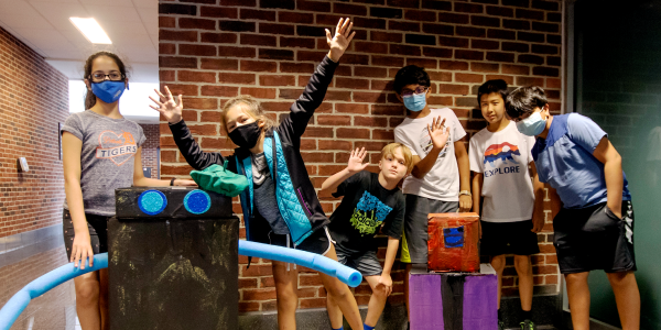 Group of kids and their cardboard projects