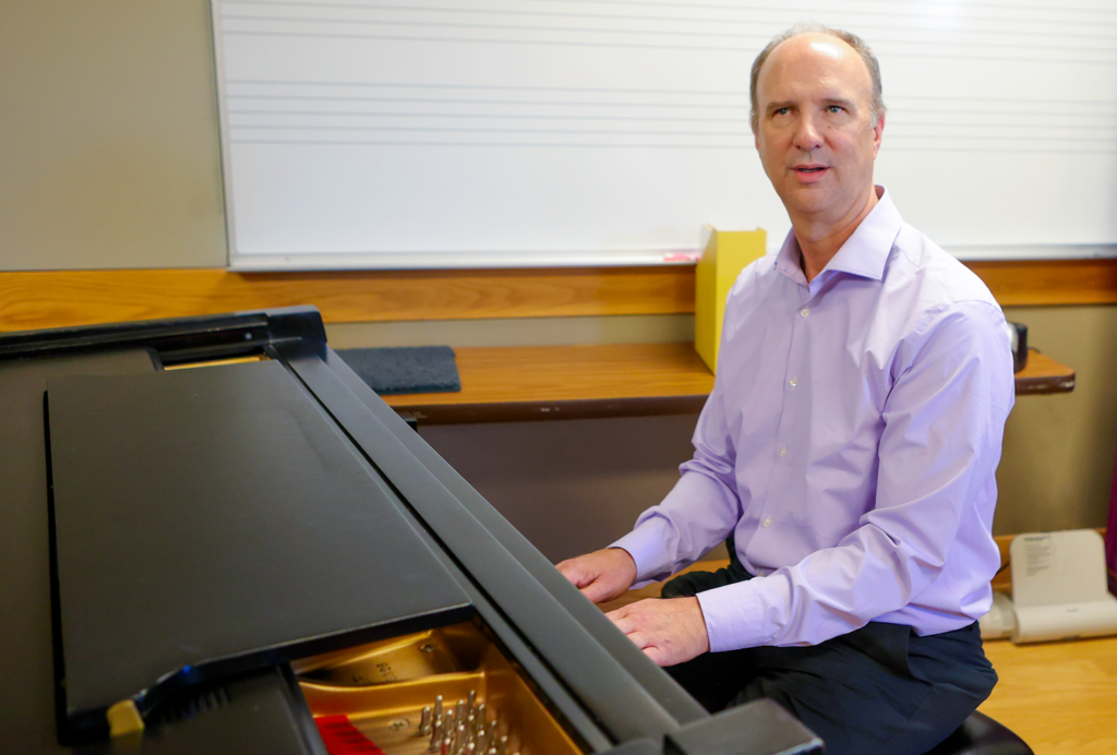 Man sits at piano 