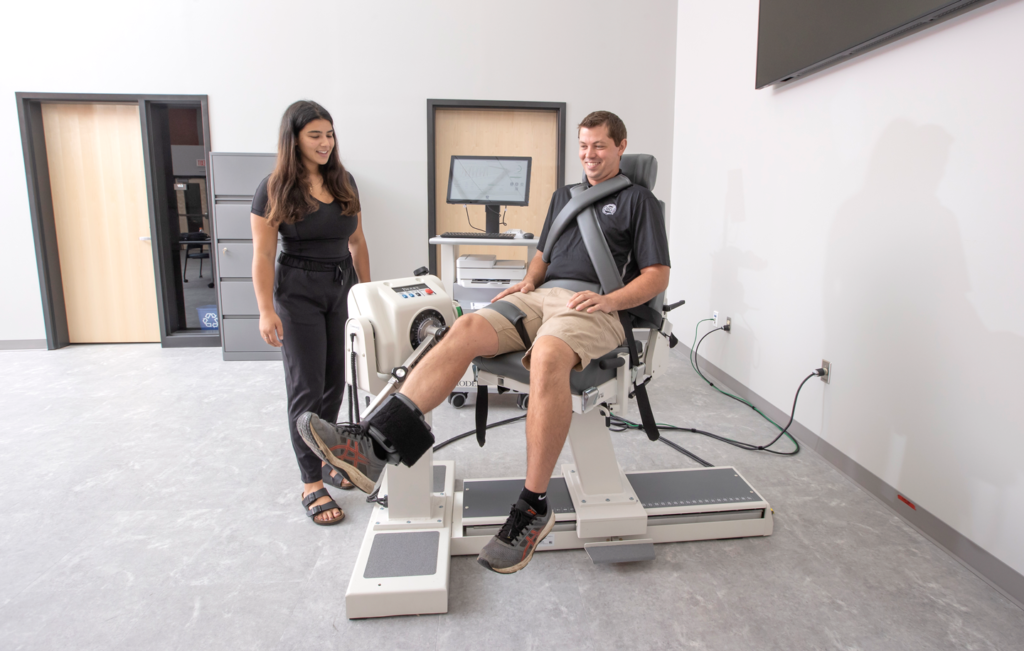 Two people using medical machinery