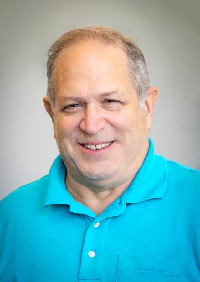 Headshot of a man smiling