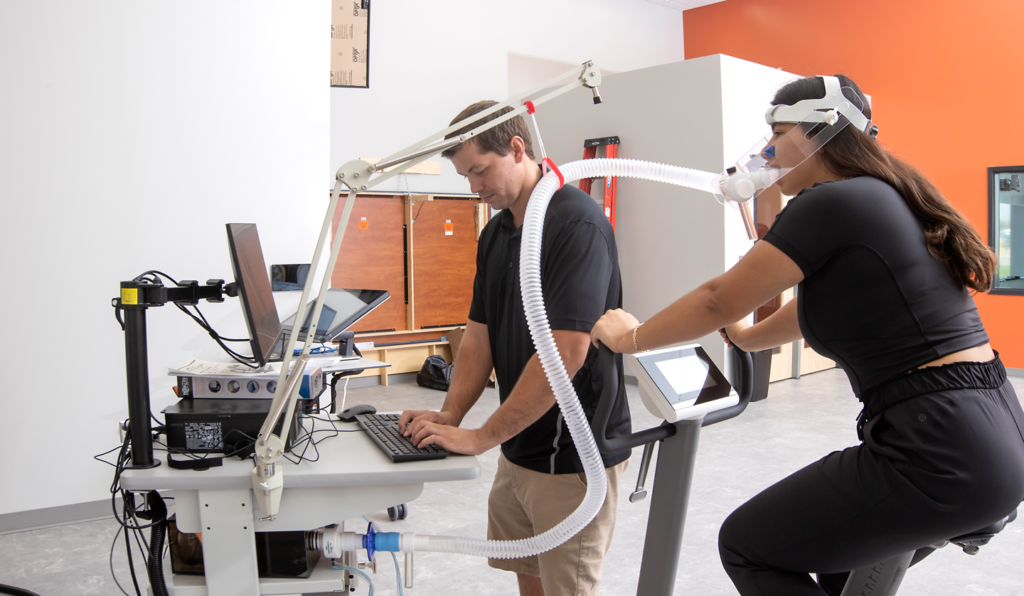 Two people using medical machinery