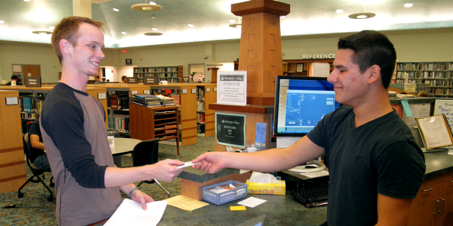 Students exchange business card