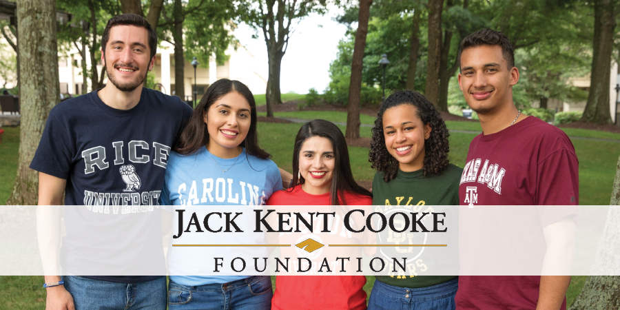 Five people standing in a row with a banner that reads "Jack Kent Cooke Foundation"