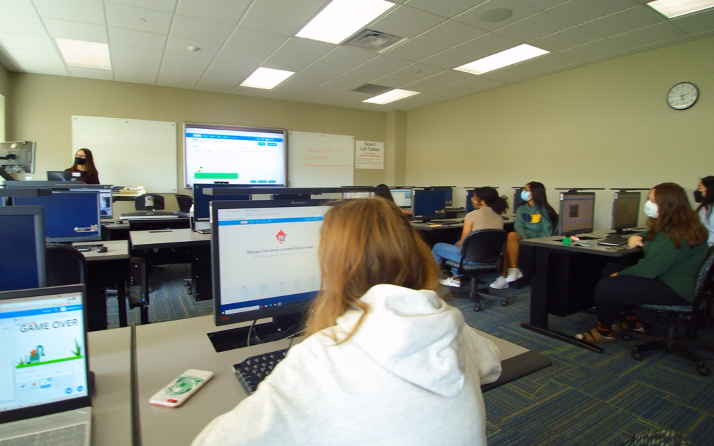 A computer lab with people learning to code