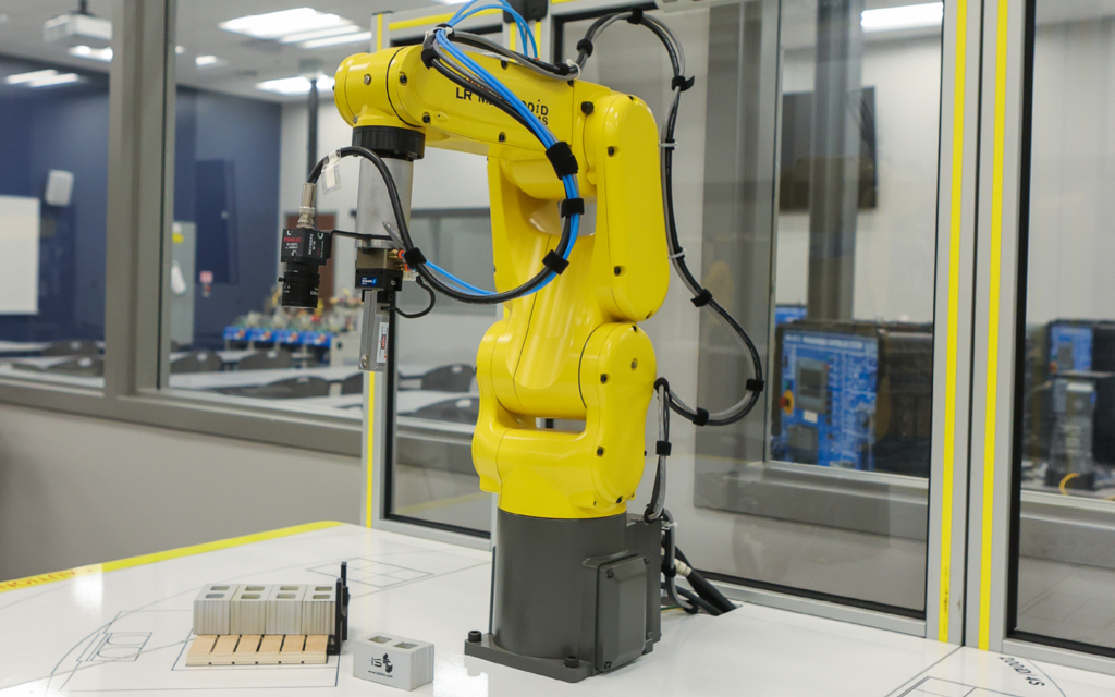 Robotic arm in a manufacturing room