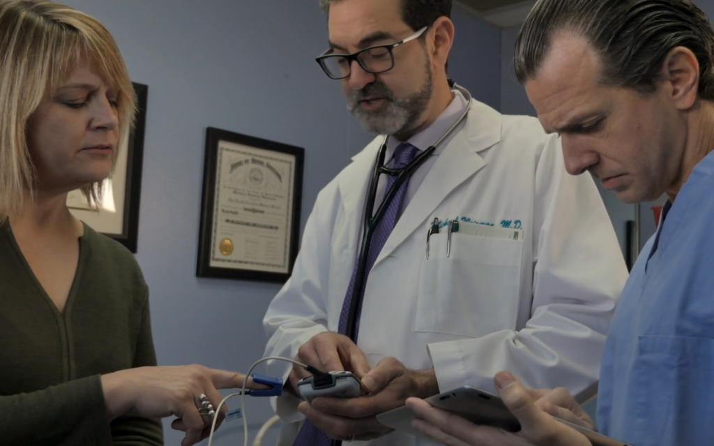 Doctor and nurse working with a patient