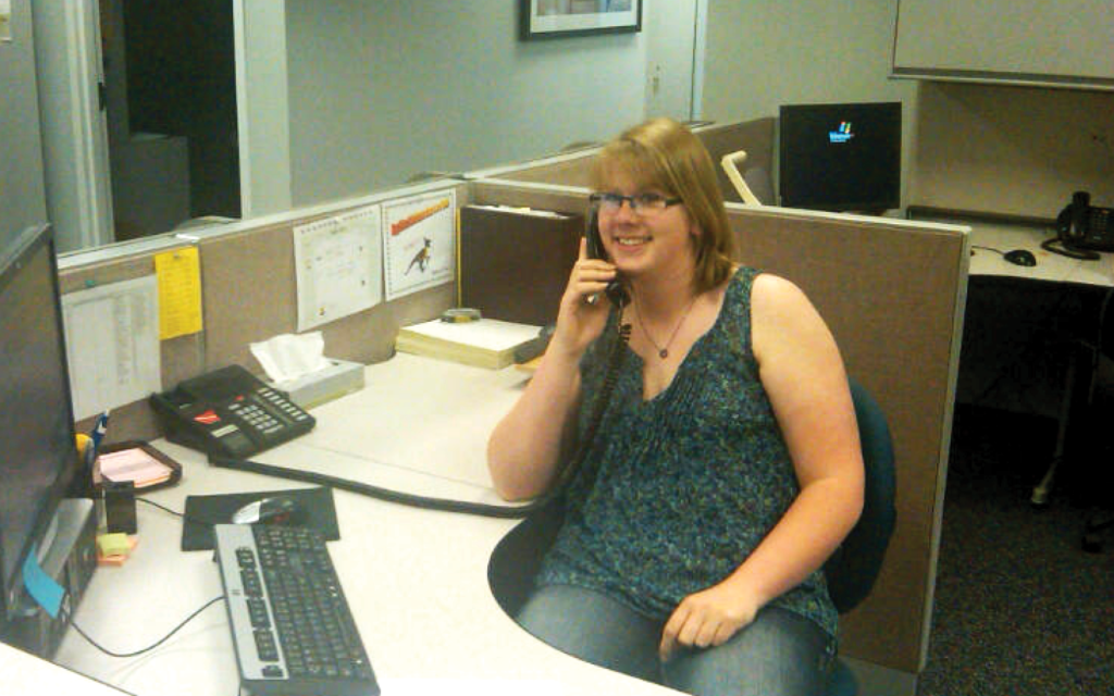 Person talking on the phone at a desk