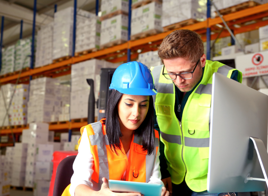 Two people in a warehouse