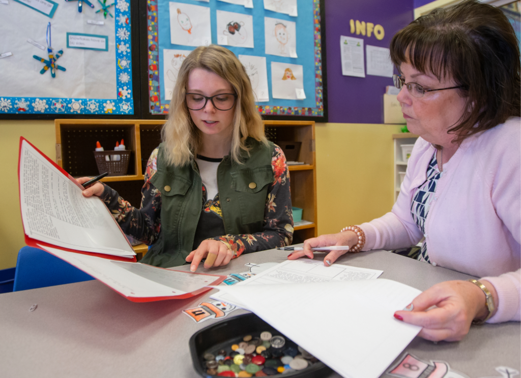 Two people reviewing plans