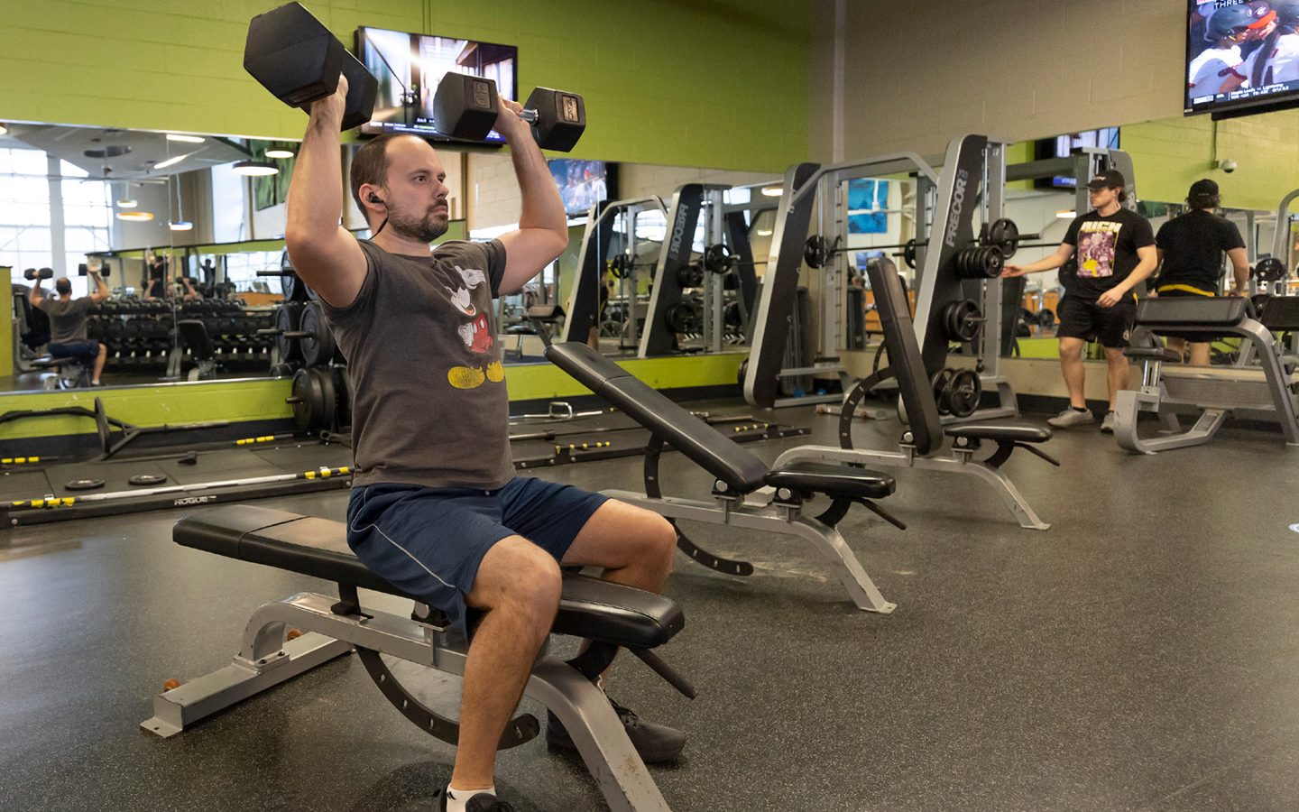 person lifting arm weights