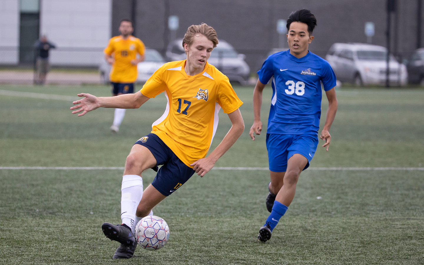 Soccer player dribbling ball