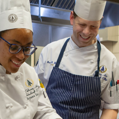 chef and student smiling